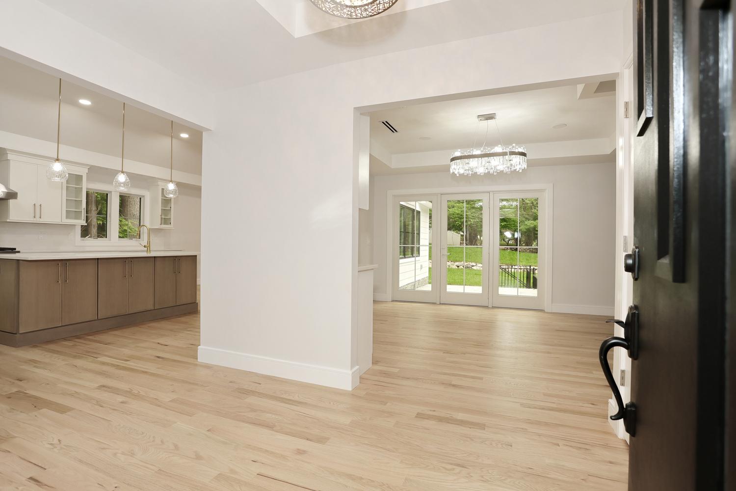 Hillsdale NJ custom home — Foyer Opening to Dining Room — Dadak LLC