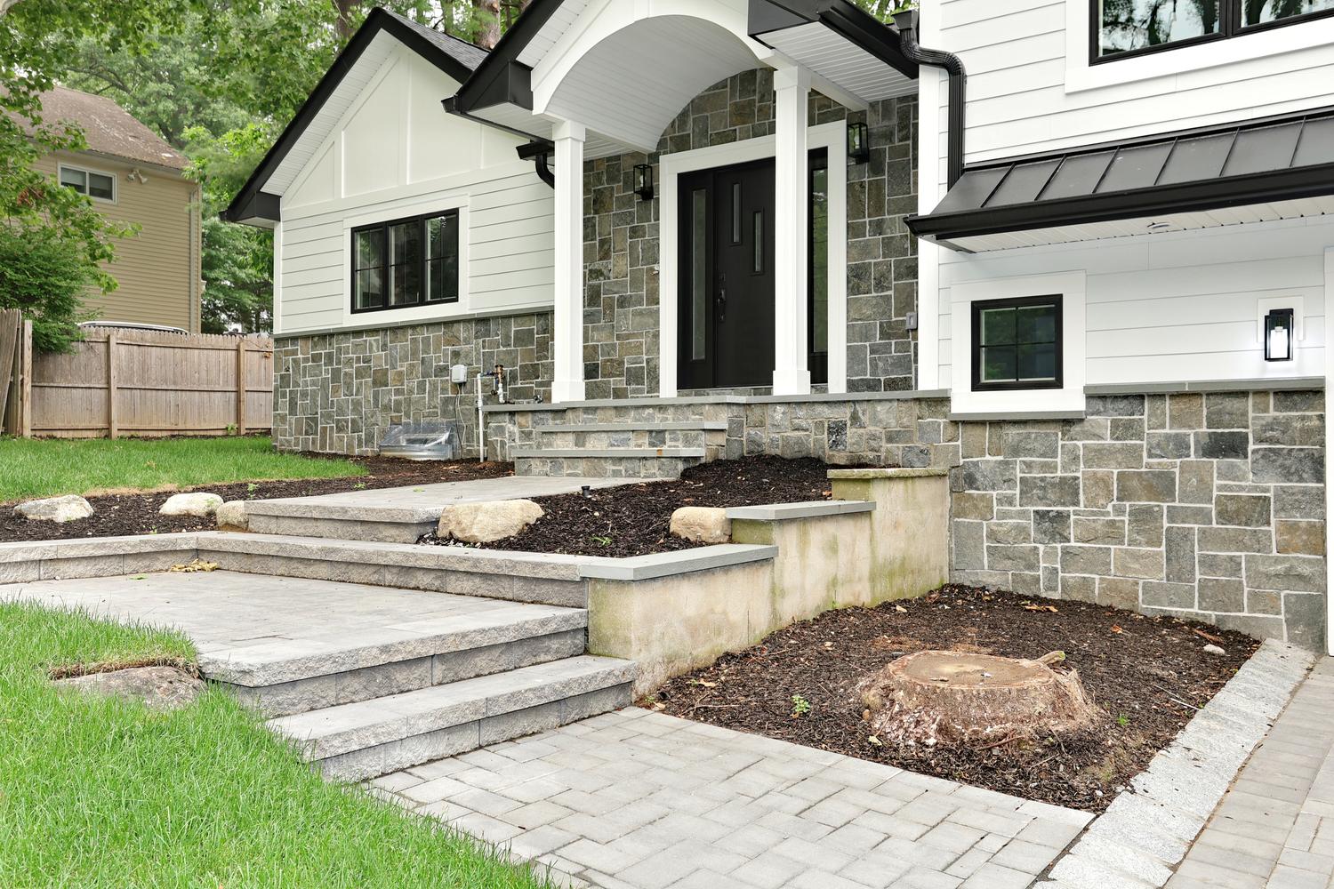 Hillsdale NJ custom home — Arched Stone Portico Entry — Dadak LLC