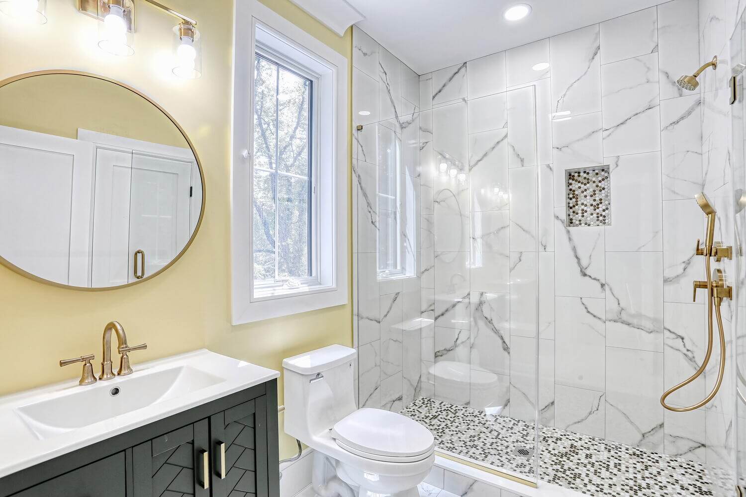 Montvale bathroom — Guest Bathroom Marble Tile And Gold Fixtures — Dadak LLC