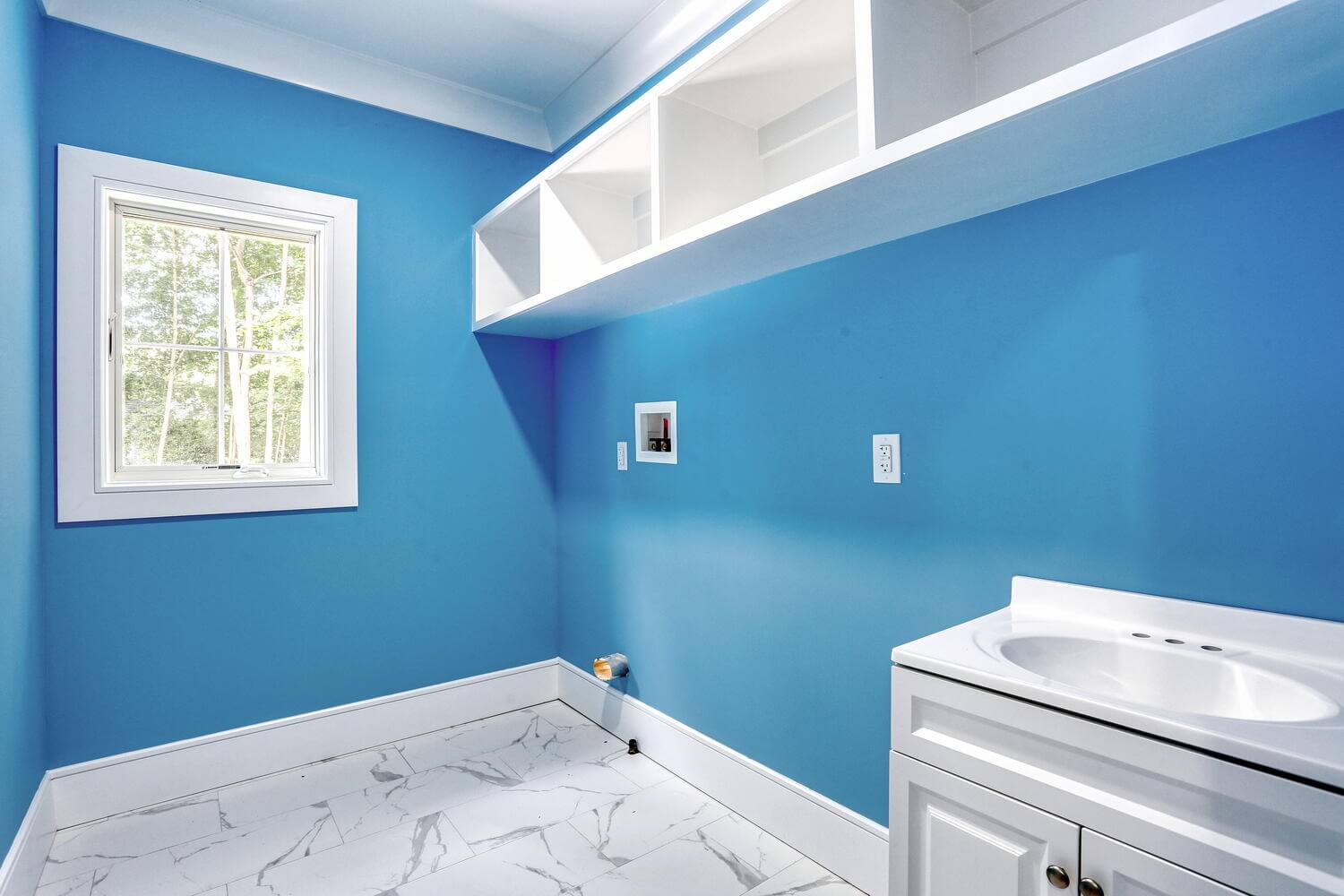 Montvale living space — Laundry Room Built Ins Blue Walls — Dadak LLC