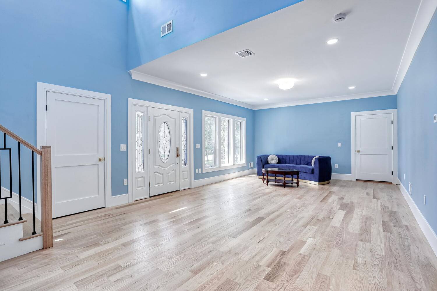 Montvale living space — Living Room Blue Walls Entry Door — Dadak LLC