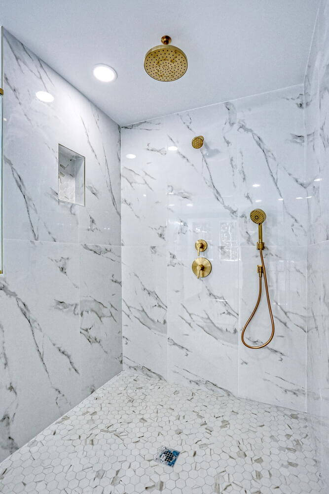 Montvale primary suite — Primary Bathroom Gold Fixtures Shower Detail — Dadak LLC