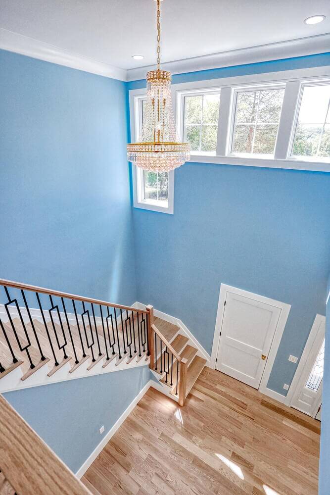 Montvale entryway & stairs — Staircase Chandelier Detail — Dadak LLC