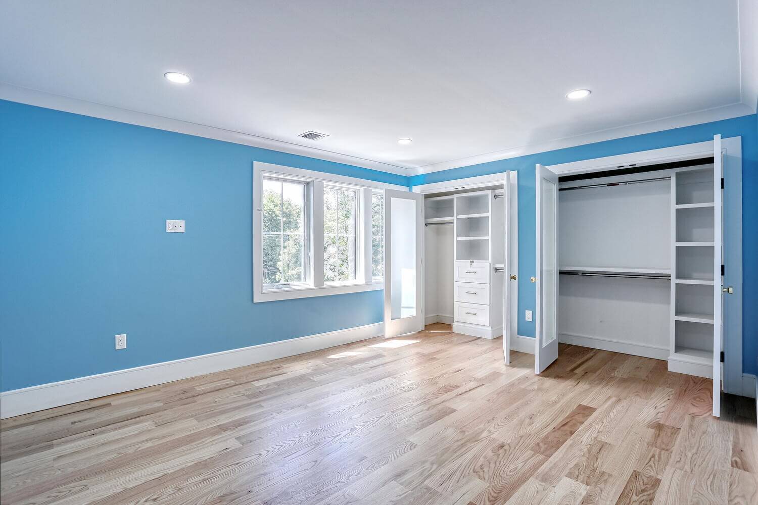Montvale bedroom — Upstairs Bedroom Blue Walls Hardwood Floor — Dadak LLC