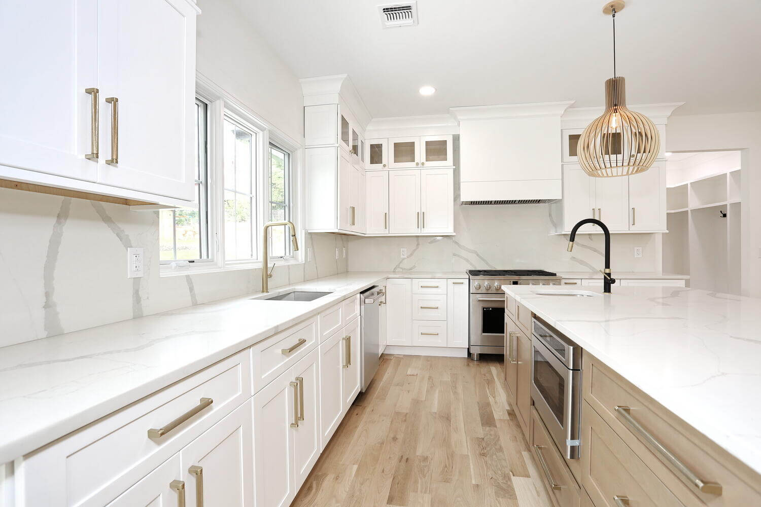 Custom kitchen with quartz countertops and professional range, renovated by Dadak LLC in Park Ridge NJ