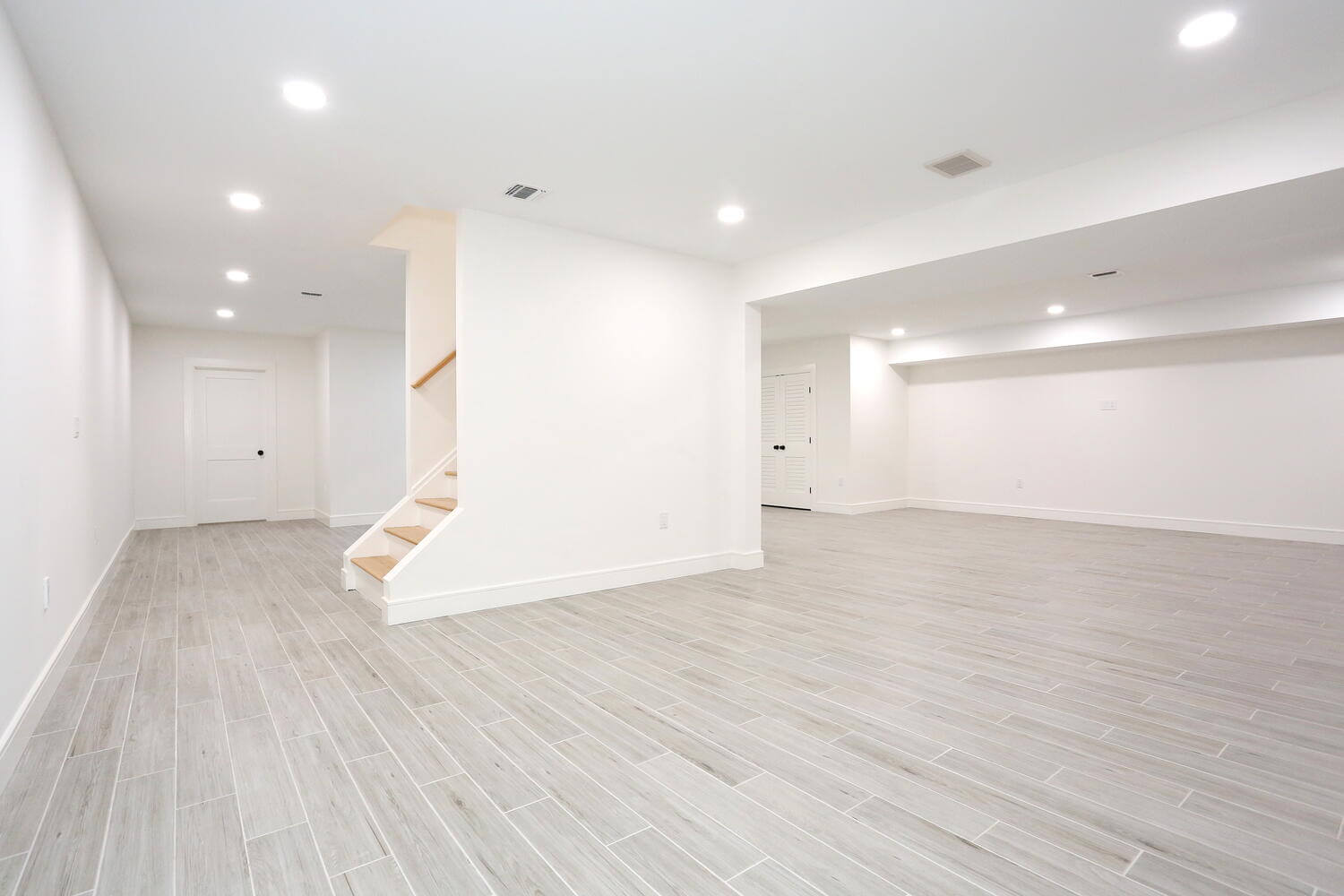 Park Ridge basement — Lower Level Main Living Area Stair View — Dadak LLC