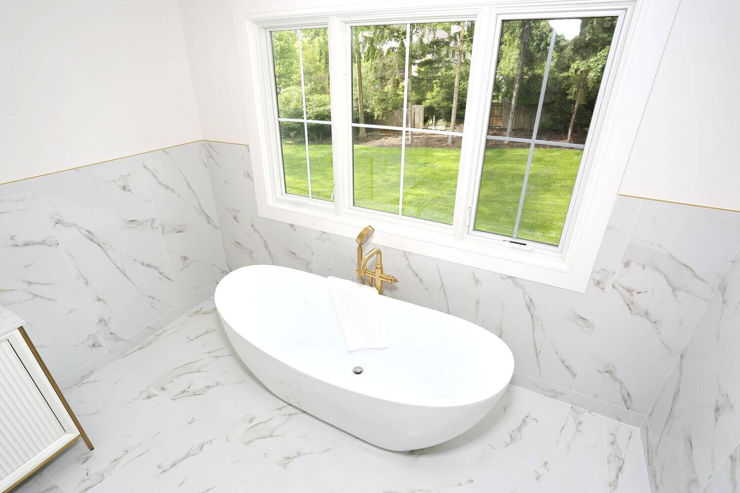 Park Ridge primary suite — Primary Bathroom Tub Window View — Dadak LLC