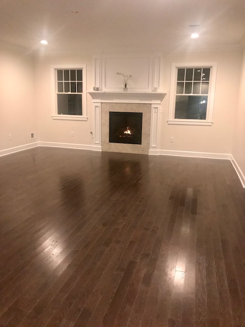 Westwood — Living Room Fireplace at Evening — Dadak LLC