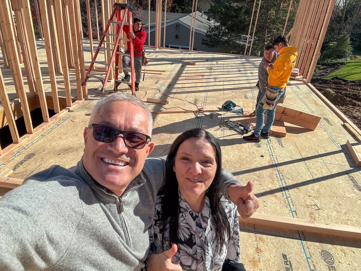 Dragan and Kosa Dinic, founders of Dadak LLC, taking a selfie together on an active construction site in Bergen County NJ